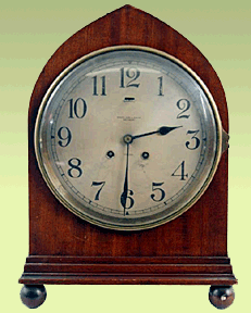 Chelsea wood-cased Gothic mantel clock.