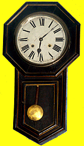 An antique regulator pendulum clock.